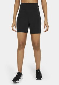 Black short athletic shorts made of stretchy fabric. High waist design with a smooth texture. Small white logo on the front waistband.