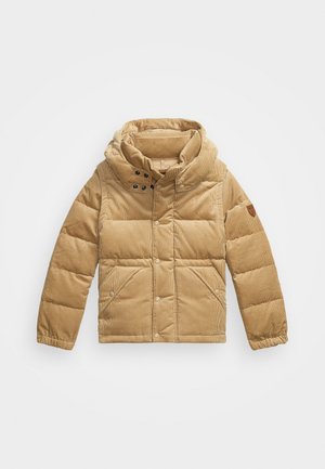 Doudoune beige avec capuche, fabriquée en velours côtelé. Dispose d'une fermeture éclair, de boutons-pression et de deux poches avant. Surface texturée.