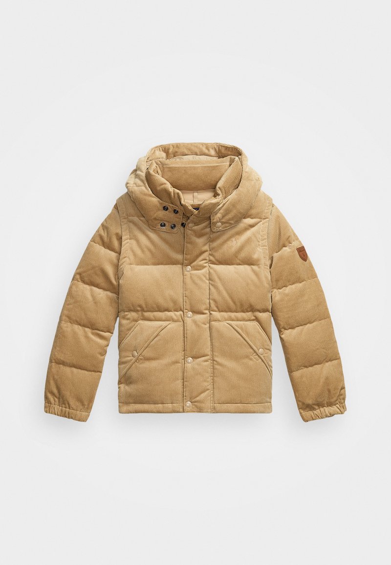 Giacca puffer beige con cappuccio, realizzata in corduroy. Presenta una chiusura a zip, bottoni a pressione e due tasche frontali. Superficie testurizzata.