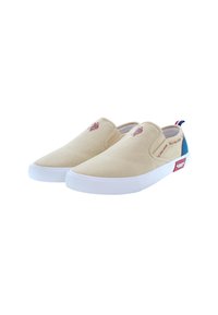 Beige canvas slip-on shoes with white rubber soles, featuring a maroon logo and blue accents on the heel, simple design, and no laces.