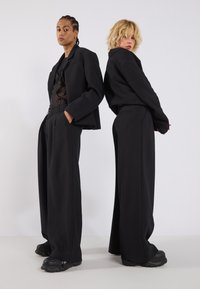 YOURTURN UNISEX - Tygbyxor - black