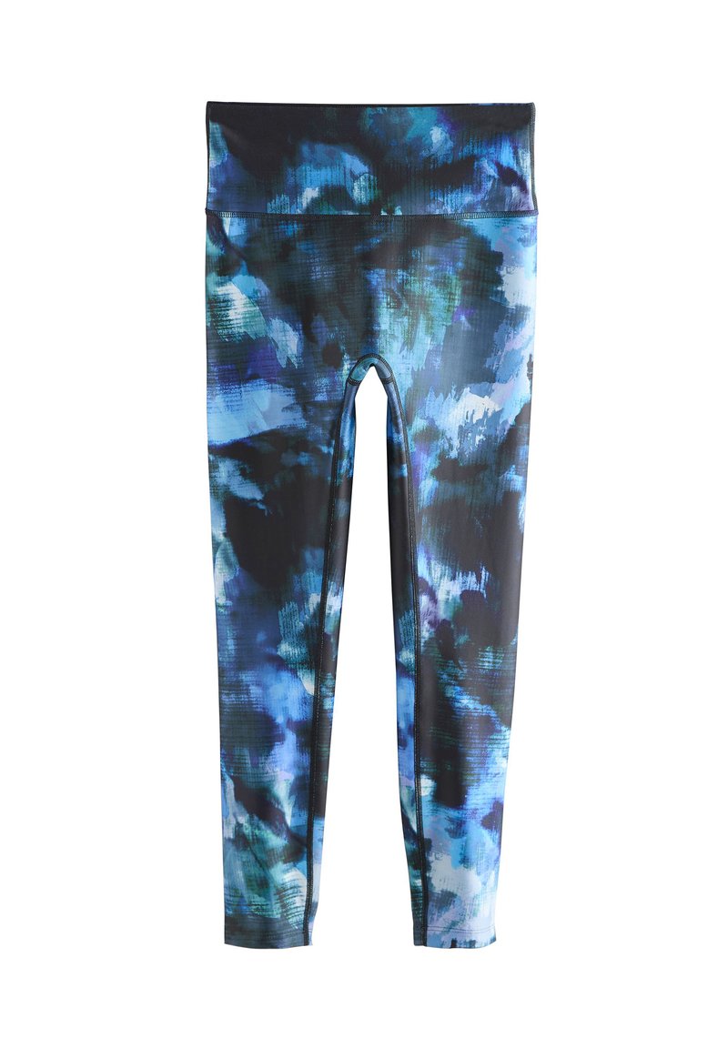 Leggings bicolor hechos de tela elastizada. Presentan un patrón abstracto en azul y negro, cinturilla alta y diseño hasta el tobillo.