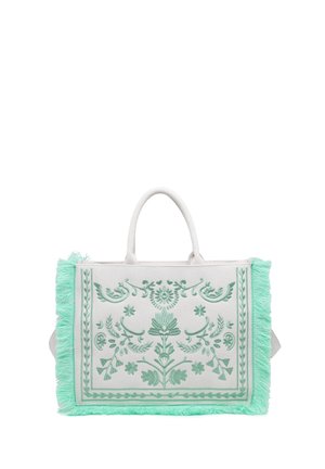 Borsa tote bianca con ricamo floreale verde menta e dettagli di frange lungo i bordi, con due manici bianchi in alto.