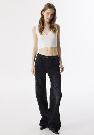 DISTRESSED EFFECT - Flared Jeans - black