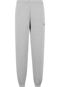 Grijze sweatpants van zacht materiaal, met een elastische tailleband, tapered legs en een klein logo detail op de linkerdij.