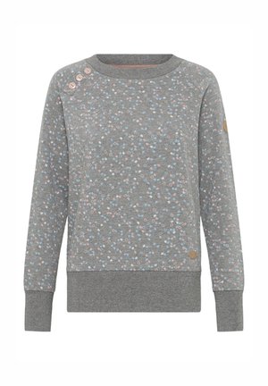 Pelēks džemperis ar rozā un ziliem plankumiem. Tam ir ribota apļa kakla un aproču apdare, kā arī dekoratīvas pogas uz pleca.