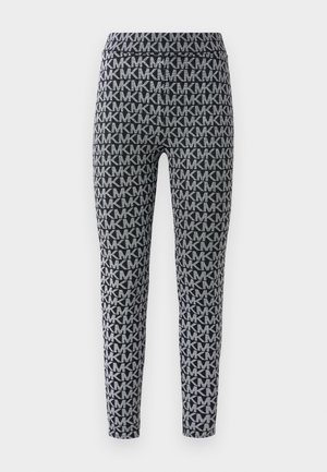 Leggings negre și gri cu un model all-over de litere interconectate. Bretelele sunt elastice, cu o croială slim pe picioare.