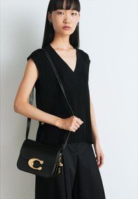 COACH IDOL BAG - Ručna torba - black