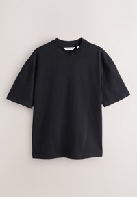 Fekete rövid ujjú pamut póló. Kerek nyakkivágással és kényelmes, laza szabással, tiszta varrásokkal. Simaságával és mintázat nélküli felülettel rendelkezik.