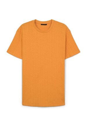 T-shirt a maniche corte di un vivace arancione, realizzato in tessuto testurizzato con motivo a trecce, con scollatura rotonda e vestibilità rilassata.
