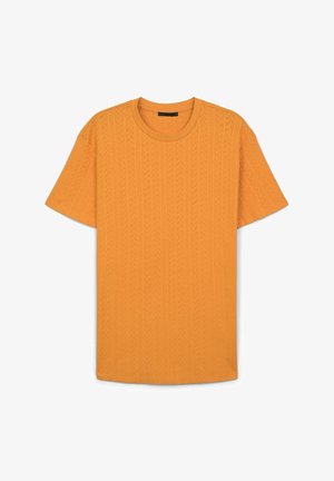T-shirt a maniche corte di un vivace arancione, realizzato in tessuto testurizzato con motivo a trecce, con scollatura rotonda e vestibilità rilassata.