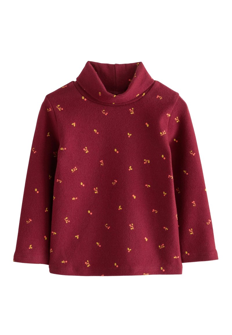 Chemise à col roulé bordeaux à manches longues avec de petits motifs de baies jaunes et orange dispersés sur le tissu.