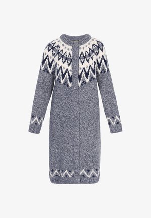 Tumedast sinisest õhkkardiganist, millel on valge mustriga yoke ja sakilised aktsendid. Omab pikaid varrukaid, ümarat kaela ning esist lukku.