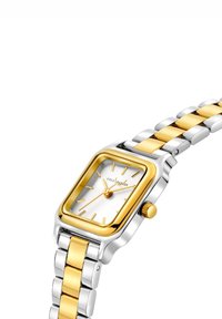 Quadratische Uhr mit silbernem Zifferblatt und goldenen Akzenten. Armband aus Edelstahl mit abwechselnd silbernen und goldenen Gliedern. Krone an der Seite.