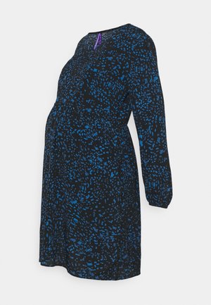 Robe de maternité noire à manches longues, motif abstrait bleu, et détail de fermeture éclair violet au niveau du col, présentée sur fond blanc.
