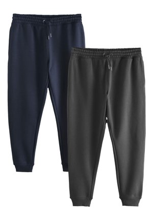 Zwei Paare mit Bündchen versehene Jogginghosen mit elastischen Taillenbändern und Kordeln, eines dunkelblau und eines schwarz, nebeneinander auf weißem Hintergrund.