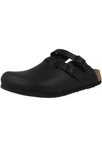 Black clogs with two adjustable buckles, a rounded toe, cork footbed, and textured rubber sole for traction. Smooth matte finish.