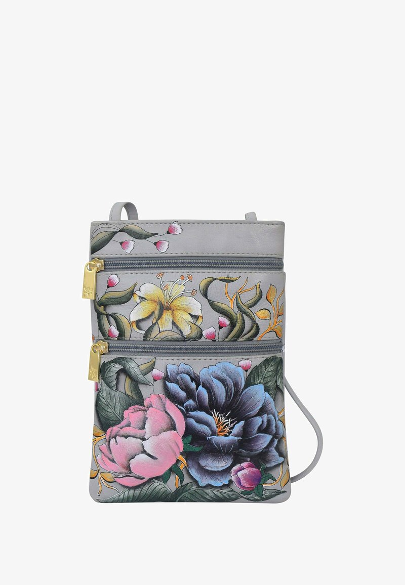 Grijze leren tas met bloemendessins in roze, blauw en geel. Twee met rits afgesloten vakken met gouden hardware accenten.