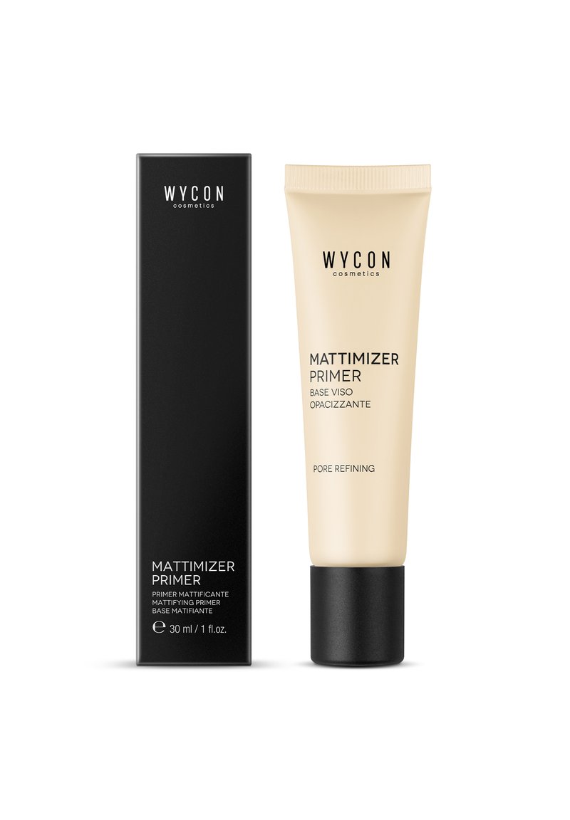 Primer Mattimizer in un tubo beige con un tappo nero accanto a una scatola nera alta. Entrambi presentano un marchio in testo bianco. Indicata dimensione di 30 ml.