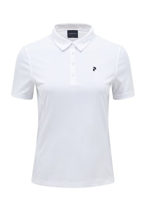 Polo blanc en tissu lisse et léger. Dispose d'un col classique, d'une patte de boutonnage et d'un petit logo noir sur la poitrine.