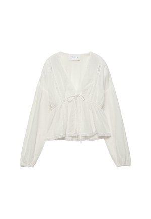 Weiße Bluse mit langen Ärmeln und V-Ausschnitt, tailliert mit einem vorne gebundenen Kordelzug und zarten Spitzenbesätzen.