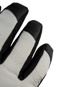 Close-up of three glove fingers with reinforced black tips and grey fabric with stitched details.