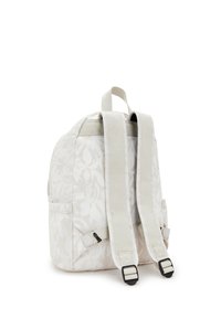 Zaino di colore chiaro con un motivo floreale, realizzato in materiale tessile, dotato di due spallacci regolabili e di una maniglia superiore. Presenta tasche laterali e fibbie.