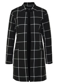 Blazer long noir avec un motif à carreaux blanc, fermeture ouverte, col à revers et poches à rabat de chaque côté.