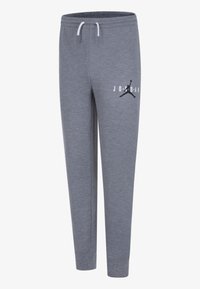 Grå joggebukser laget av mykt stoff med elastisk midjebånd og snor. Har trykt logo og silhuett på venstre lår.