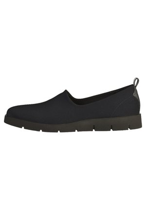 Zapato plano negro tipo slip-on con suela gruesa y estriada y lengüeta en el talón, diseñado para uso casual o diario.