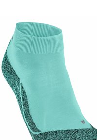 Turkusowa skarpetka za kostkę z teksturowanym czarnym wzorem, z prążkowanym mankietem i logo, prezentowana na białym tle.