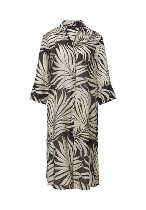 Korte mouwen, knoopsluiting jurk gemaakt van lichtgewicht stof. Heeft een zwart-wit bladpatroon, met een losse pasvorm en een zoom die voorbij de knieën komt.