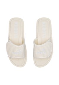 White slip-on sandals with ribbed strap and textured insole. Features "KUBOTA" logo and a thick sole with patterned tread for grip.