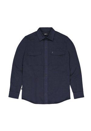 Navyblauwe langarmshirt gemaakt van zacht materiaal, met twee borstzakken, knoopsluiting en een puntkraag.
