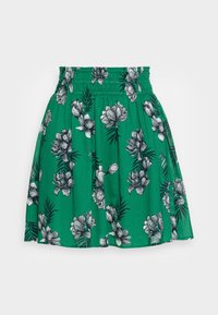 Groene rok met een bloemmotief van zwart-witte bloemen, elastische tailleband, geplooid ontwerp en knielange snit.