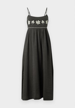Maxi dress in dark gray with adjustable spaghetti straps, embroidered floral design in white, and a gathered waist for a flowy silhouette.