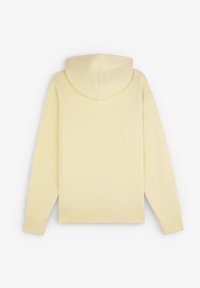 Gul hættetrøje, blødt stof, afslappet pasform, lange ærmer, ribbede manchetter og nederkant, med en bagsøm og minimalistisk design.