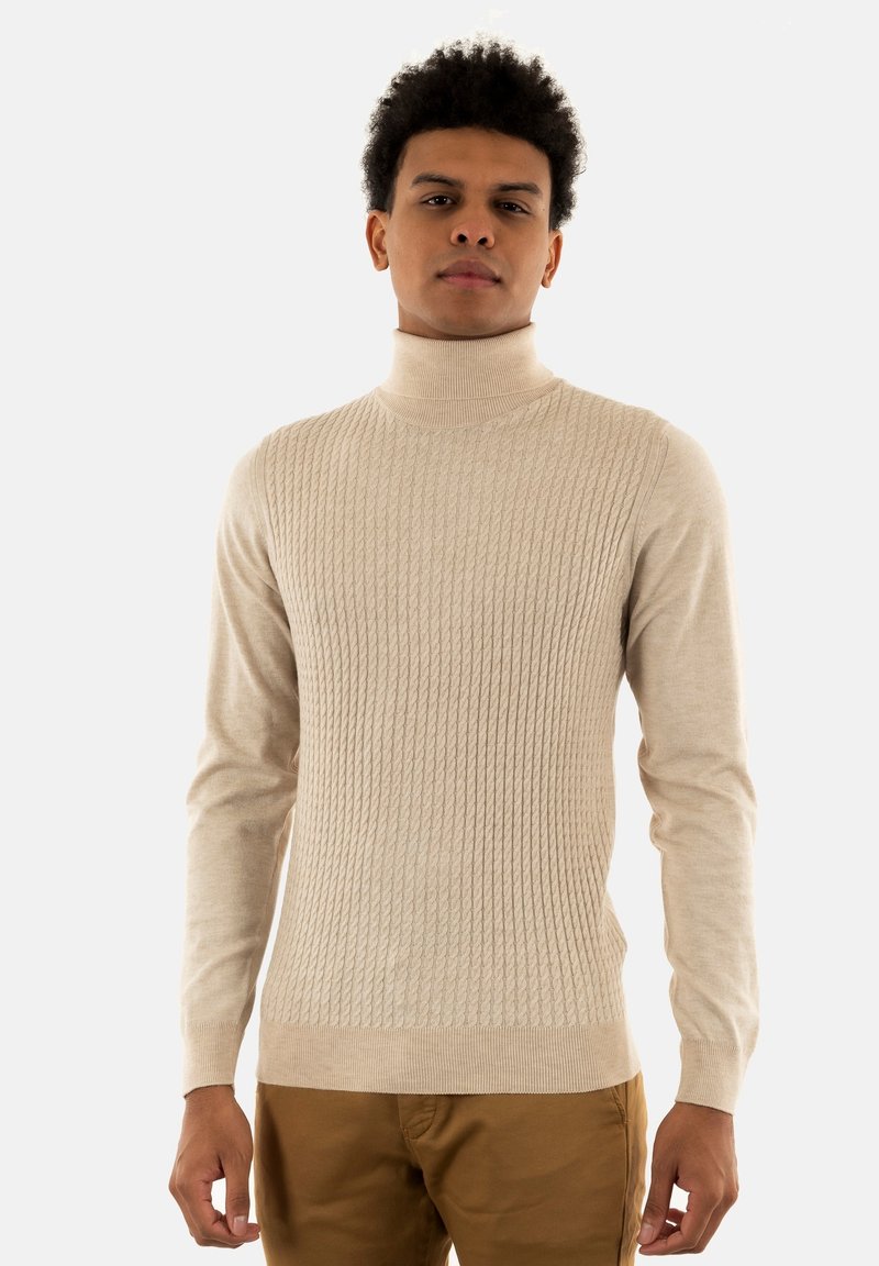 Maglione collo alto a coste beige con maniche lunghe, realizzato in un morbido materiale a maglia; presenta una vestibilità aderente e un motivo testurizzato.