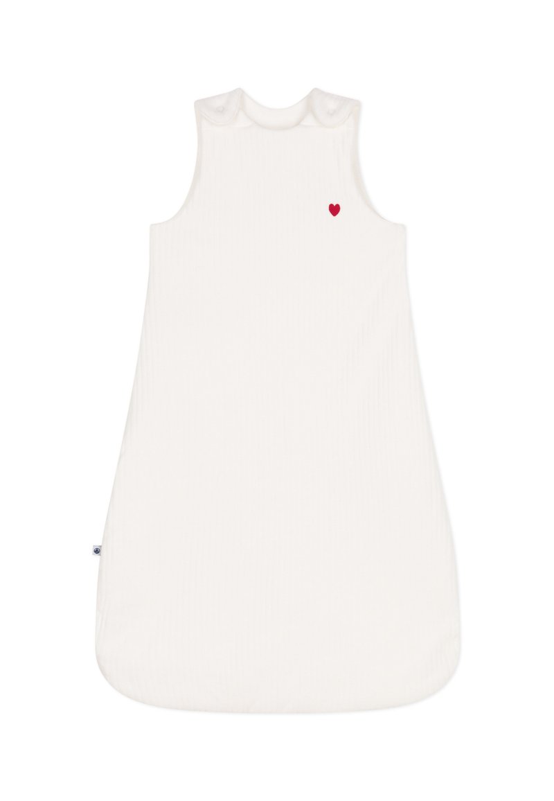Λευκό αμάνικο σάκο ύπνου από ριγέ ύφασμα, με ένα μικρό κόκκινο καρδιά κεντημένη κοντά στον αριστερό ώμο. Στρογγυλή λαιμόκοψη.