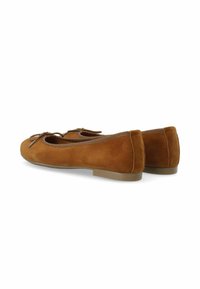 Brown suede ballet flats featuring a rounded toe, low heel, and decorative bow on the front. Soft texture with smooth interior lining.