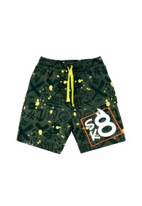 Grønne shorts med sorte grafiske mønstre og gule sprøjt. Har en elastisk talje med en lys gul snor og et hvidt "SK8" logo i en rød boks.
