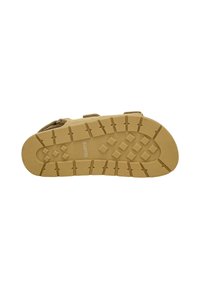 Suola di scarpa da esterno marrone chiaro con gomma testurizzata per trazione, caratterizzata da un motivo a griglia e logo del produttore impresso al centro.