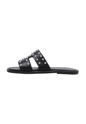 Sandales noires à glissière avec deux larges brides ornées de clous argentés. Semelle plate, fabriquée en matériau lisse, design minimaliste.