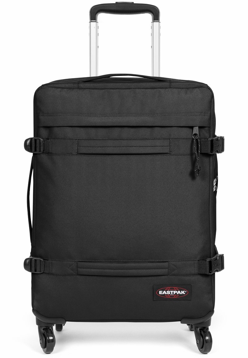 Black wheeled suitcase made of durable fabric with a telescoping handle, adjustable straps, and a front pocket. Includes rolling wheels for mobility.