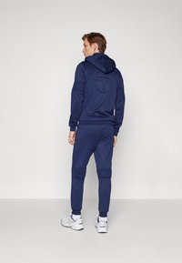 Sergio Tacchini MORET PANTS - Treniņtērpa apakšdaļas - navy