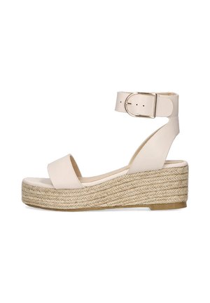 Sandaña de plataforma beige con una correa en el tobillo y un tacón de yute trenzado, que presenta un diseño sencillo y elegante, adecuado para ocasiones tanto informales como formales.