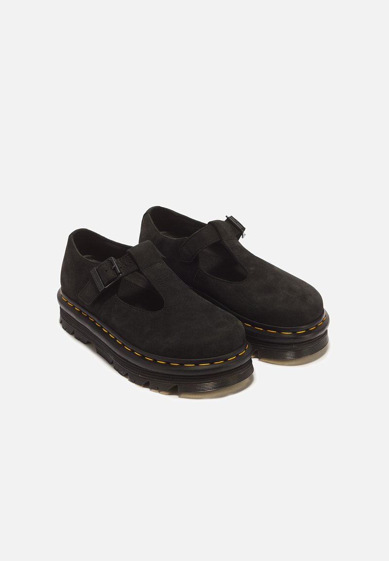 Pair of black suede Mary Jane shoes with thick soles, yellow stitching, and adjustable buckle straps, shown on a white background.