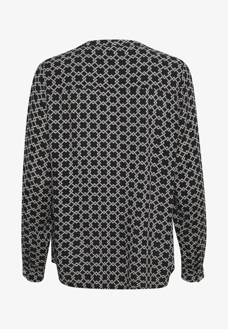 Blouse noire à manches longues avec un motif géométrique en forme de chaîne blanche, vue de dos.