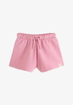 Pantalones cortos rosas para niño pequeño con cintura elástica y cordón, hechos de tela suave con una pequeña etiqueta de arcoíris en el dobladillo.