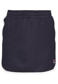 Jupe bleu marine avec une ceinture élastique, présentant des accents blancs sur les côtés et un petit logo dans le coin inférieur droit. Texture de tissu lisse.